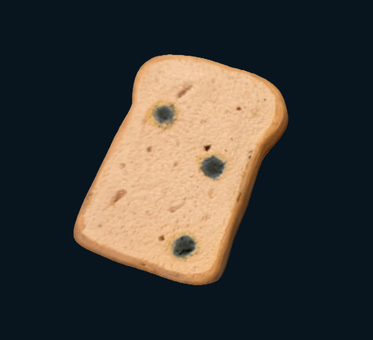 Ceramic slice of bread with spots of mould on a dark ground