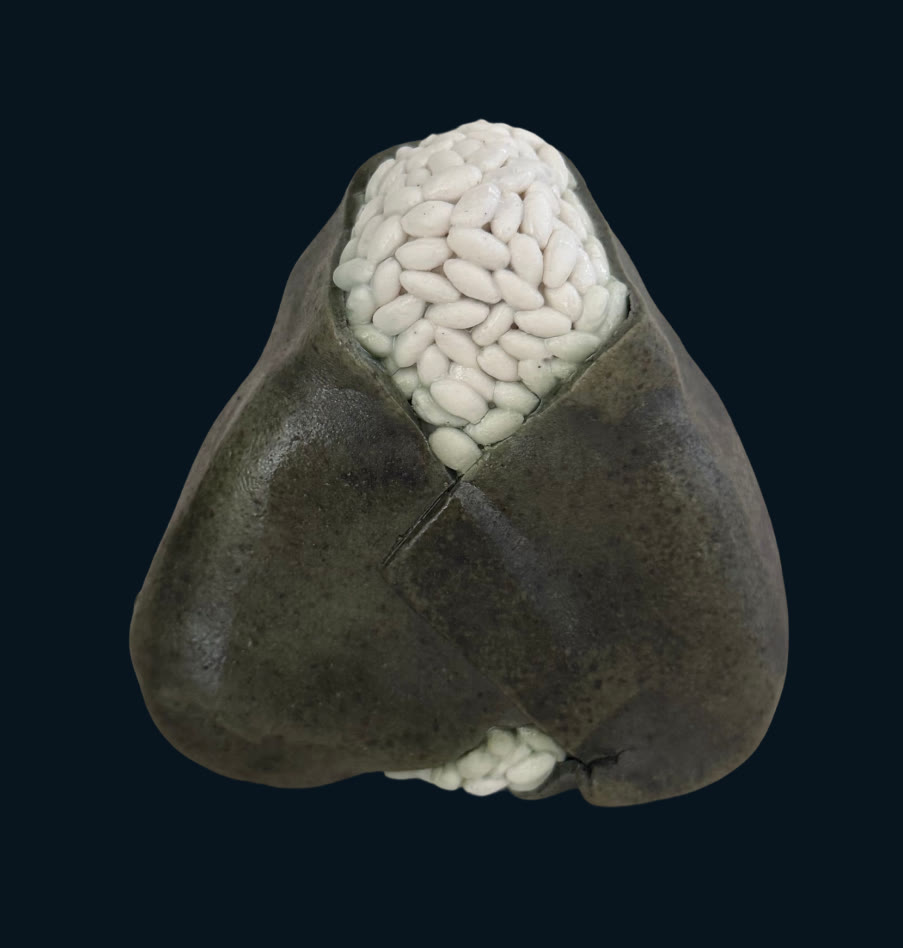 Ceramic onigiri, dark seaweed wrapping sculpted rice grains
